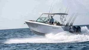 sailfish boats fishing powerboat on the water with wake