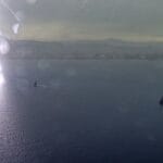 view from the air of lightening striking the water in Barcelona at America's Cup