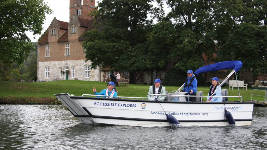 Accessible Boating Trust's new Coulam V20 Wheelyboat on the River Thames at Bisham Abbey.