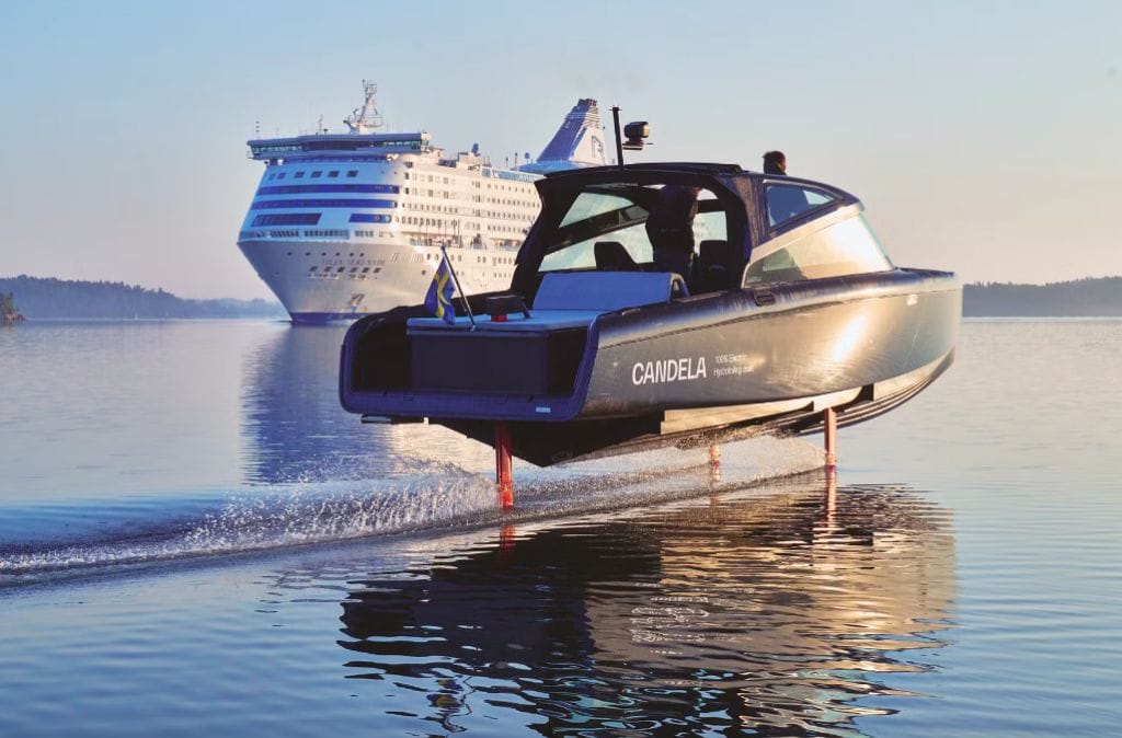 Candela c-8 electric boat with cruise ship in background