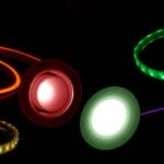 red, green and purple strip lights on black background