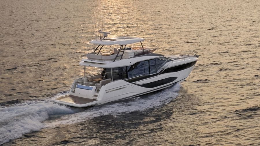 flybridge Prestige F5.7 luxury white motor yacht on passage