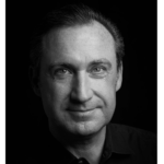 black and white picture of businessman in black shirt