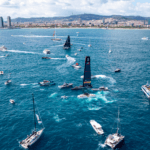 Overhead view of fleet of support and media boats surrounding America's Cup team vying to become challenger