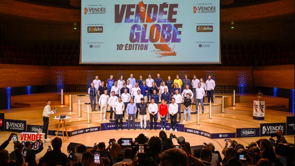 Skippers of next vendee globe stand before bank of press at conference to introduce race