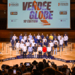 Skippers of next vendee globe stand before bank of press at conference to introduce race