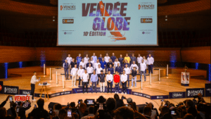 Skippers of next vendee globe stand before bank of press at conference to introduce race