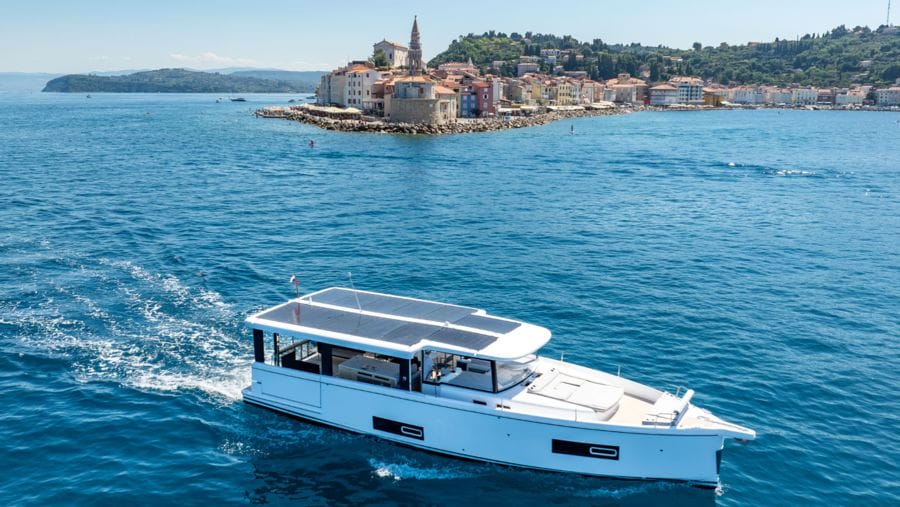 white motor boat with solar panels on pilothouse roof