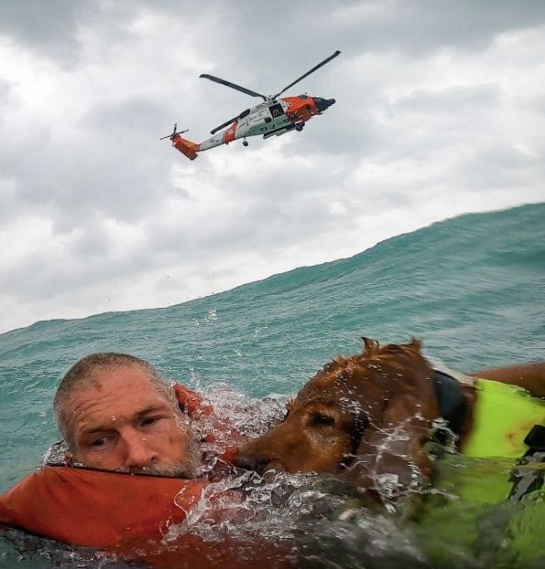 man and dog rescued by US Coastguard during Hurricane Helene