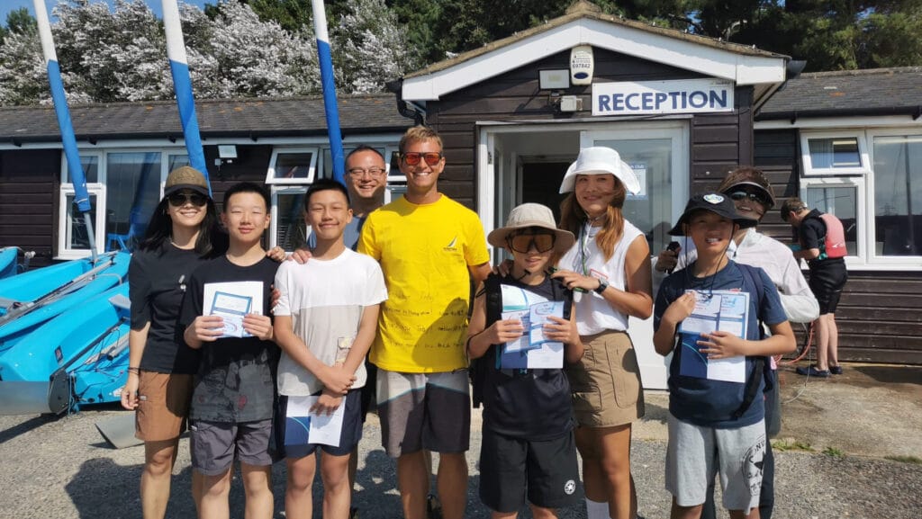 A group of children in front of Rockley Watersports premises