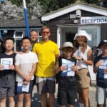 A group of children in front of Rockley Watersports premises