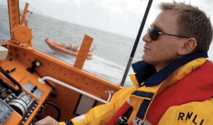 Daniel Craig 007 at helm of RNLI boat