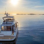 stern of Nimbus 495 Flybridge in sunset on calm waters