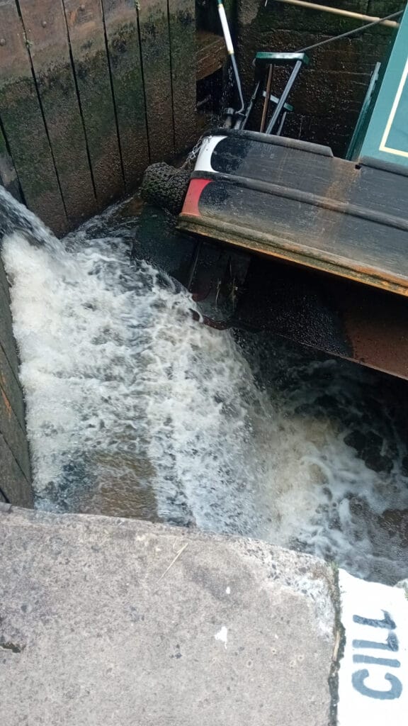 canal boat caught on a lock cill