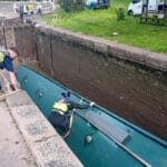 River Canal Rescue team members rescue overturned boat in lock