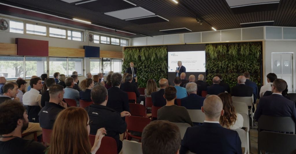 Conference room of people watching presentation on green methanol bi-fuel superyacht