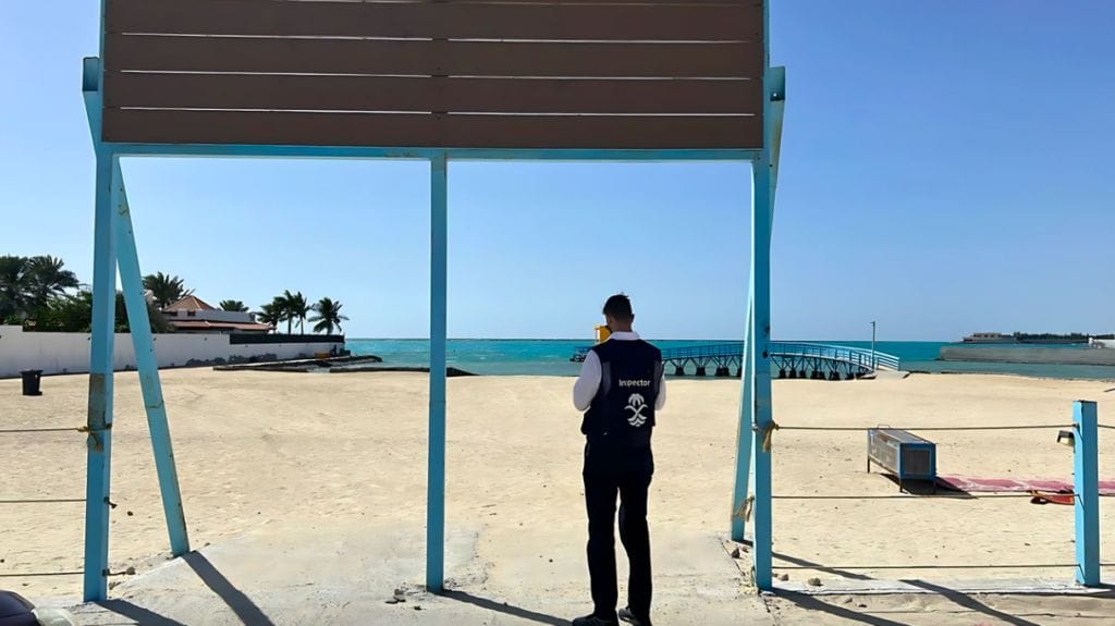 Man stands looking at empty beach ready to inspect in Saudi Arabia Red Sea