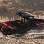 Black and red Skipper BSK boat powers through water on Supermarine open day