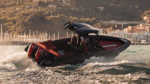 Black and red Skipper BSK boat powers through water on Supermarine open day