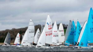 A fleet of small sailing boats on the water