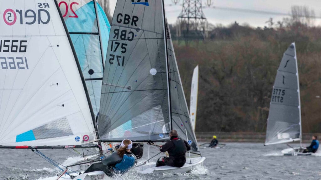 A fleet of small sailing boats on the water