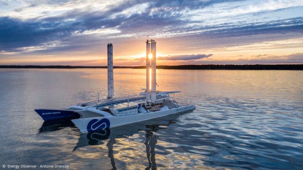 Energy Observer catamaran at sunset on ocean