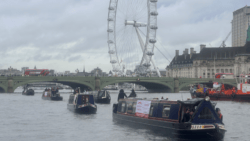 A flotilla of boats passes trhough London highlighting the need to Fund Britain's Waterways