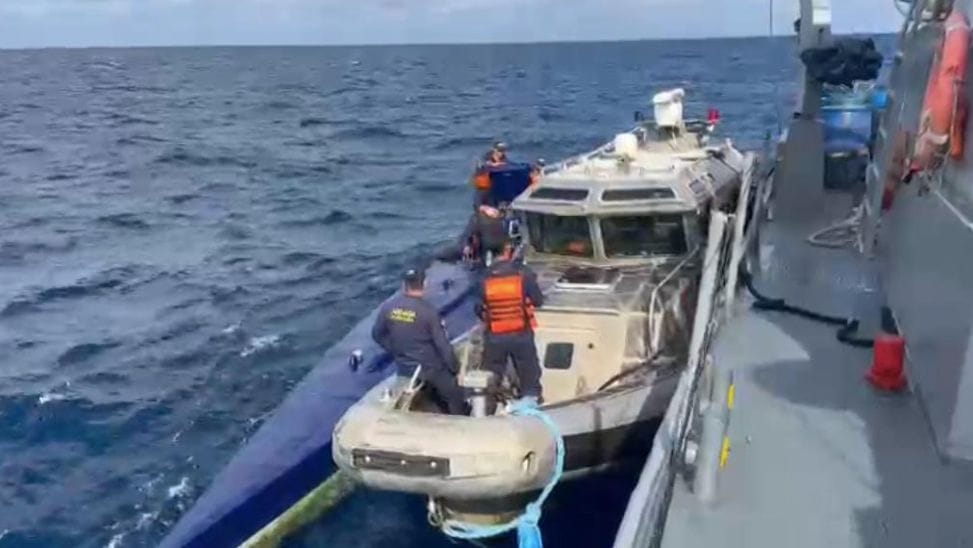 Narco sub is intercepted by small vessel and both shown alongside larger ship