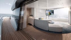 Superyacht interior with Sea 7 Symphony work on display - TV in white lounge