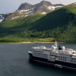 SH Diana pictured with mountains and glacier in background - a different cruise to the one where passengers are now on a hunger strike