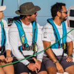 Three sailors with lifejackets on