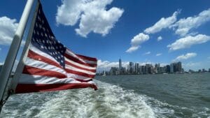 USA flag on back of boat underway