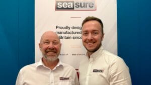 Graham Brown & Dan Henderson from Sea Sure stand in front of a Sea Sure sign