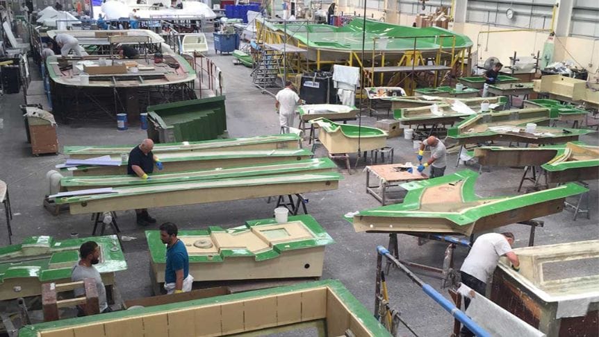 factory view of Norco workers building composite boats.