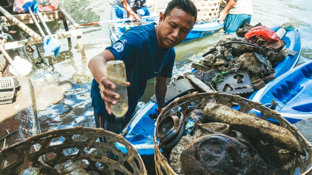 a man collecting marine litter