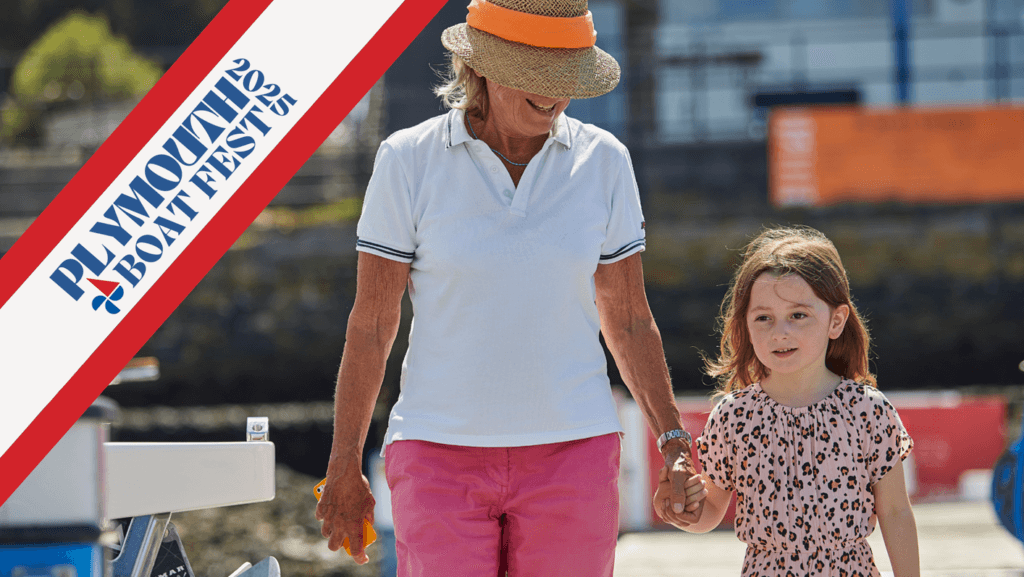 woman and young girl walking along pontoon with Plymoiuth Boat Fest logo across corner of image