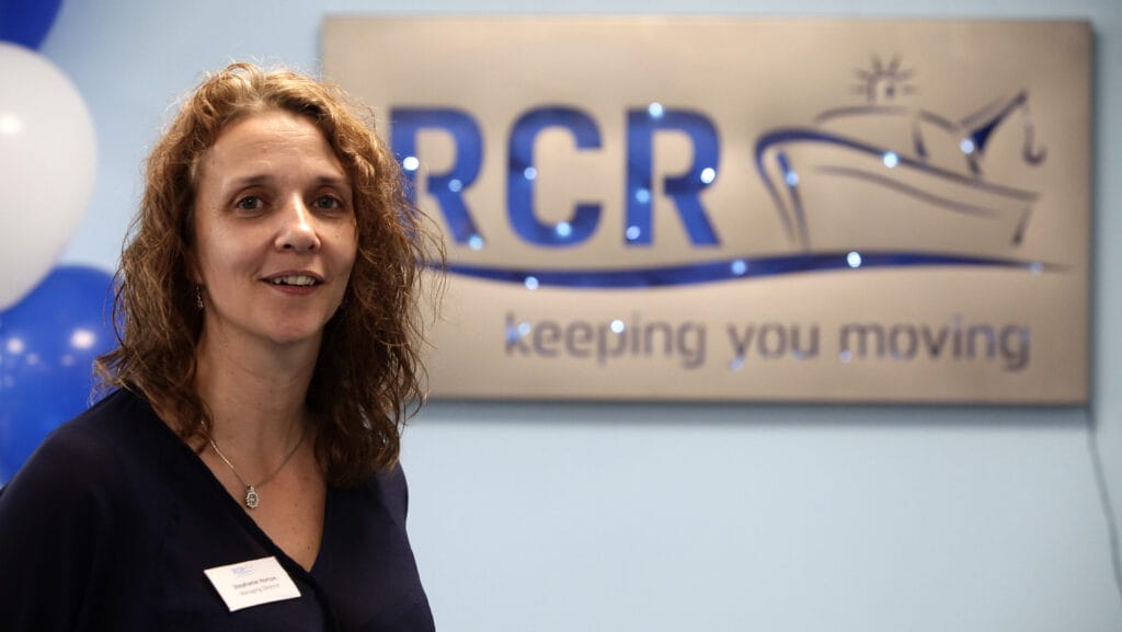 stephanie horton portrait in front of RCR logo