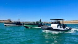 Three luxury utilitarian leisure boats line-up on the water in Jersey. Arksen 8 Arksen 30 Arksen 28 in Jersey