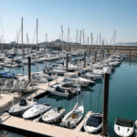 Looking over marina at Port of Jersey many yachts can be seen