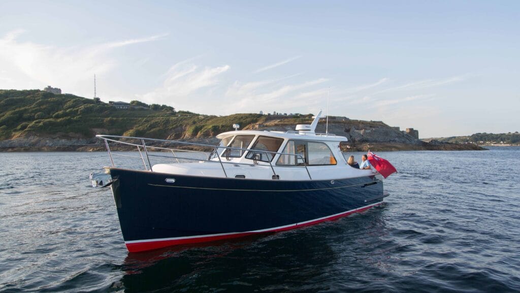 Sleek boat on the water with blue hull