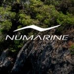 Numarine logo with backdrop image of sunny cove