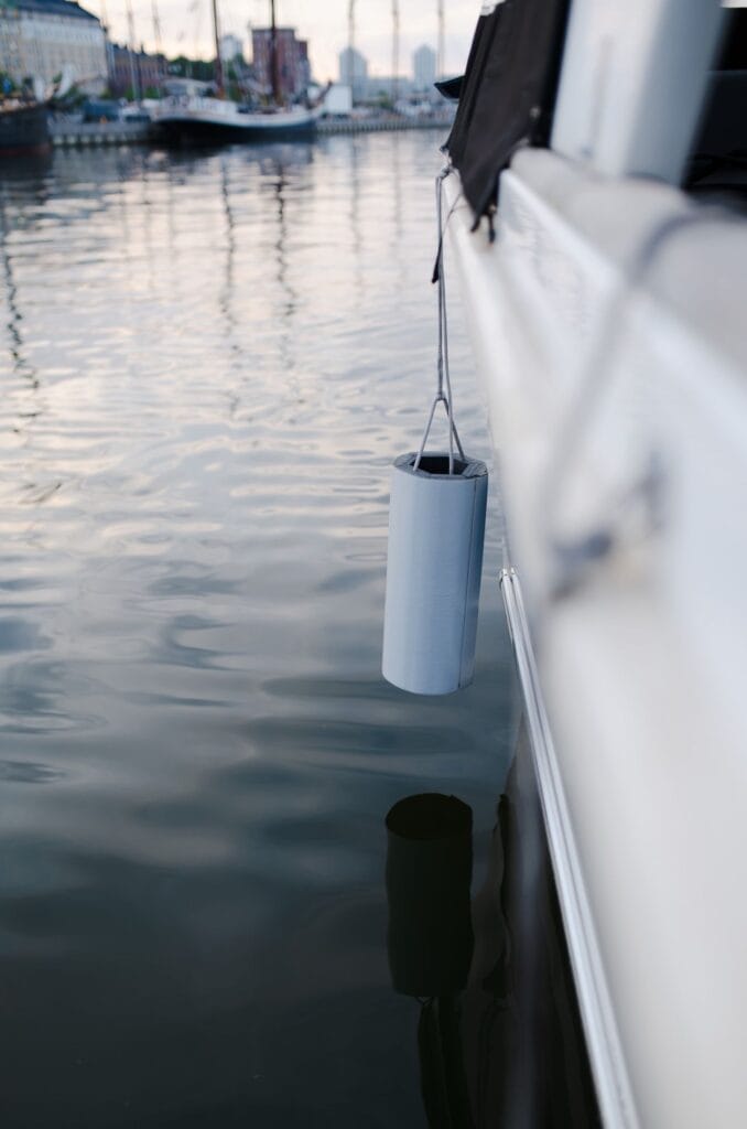 fender alongside a boat's white hull